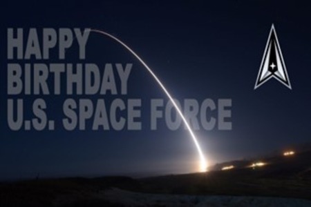 Image of the sky at night with space force logo. “Happy Birthday U.S. Space Force”